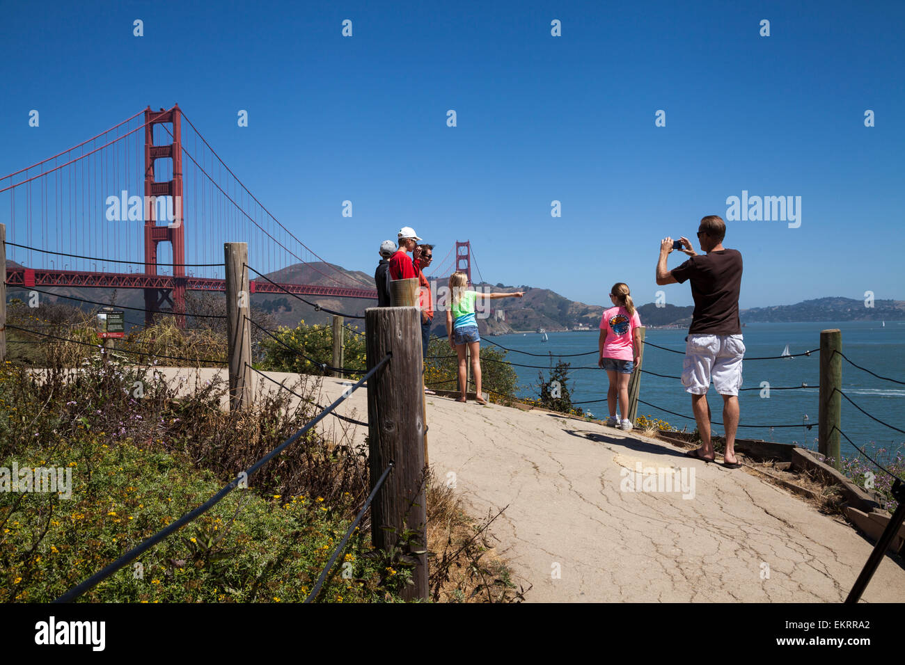 Tourists taking pictures of the Golden Gate Bridge, San Francisco, California, USA Stock Photo