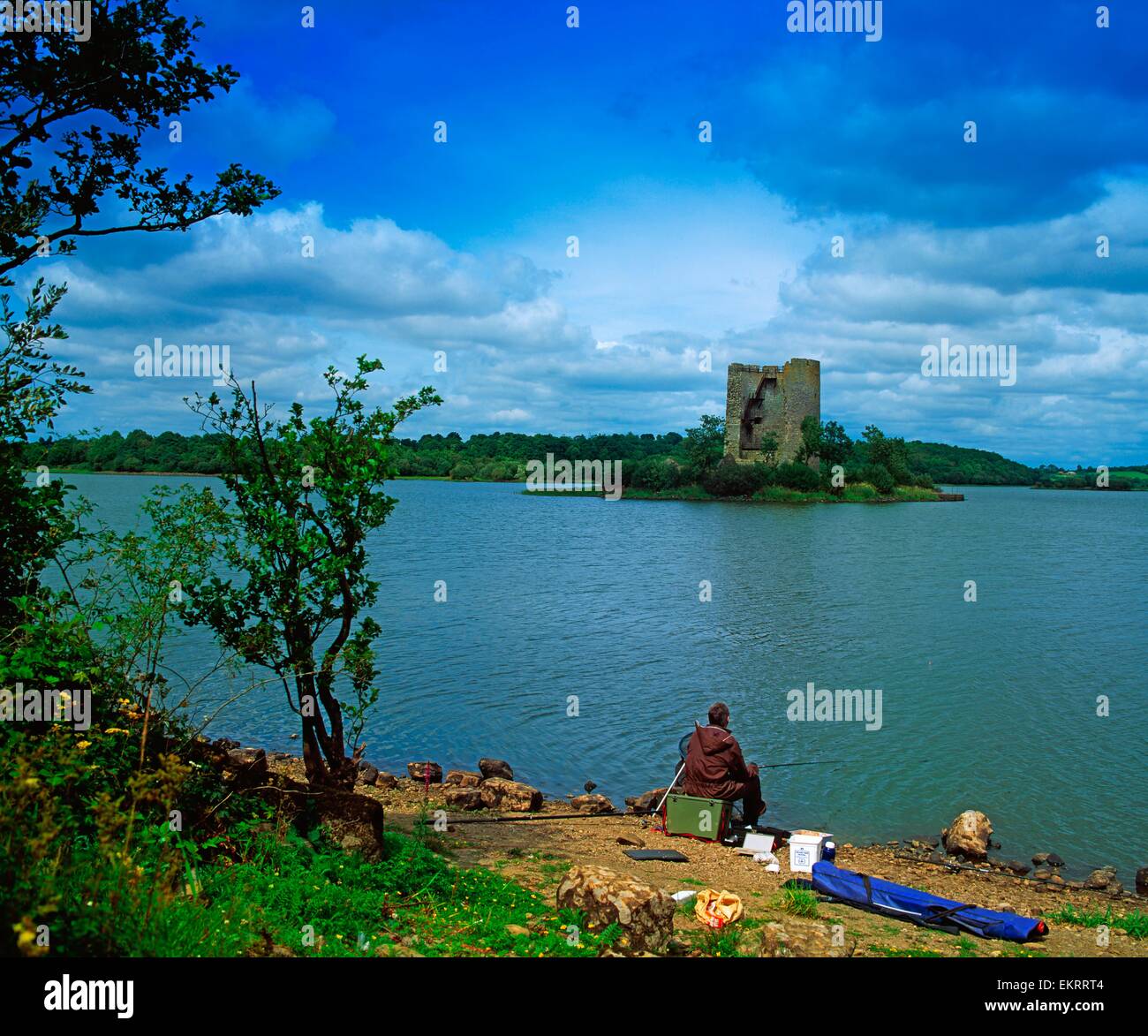 Cloughoughter Castle, Co Cavan, Ireland; Person Sitting Across From A13Th Century Castle Built On The Possible Site Of A Crannog Stock Photo