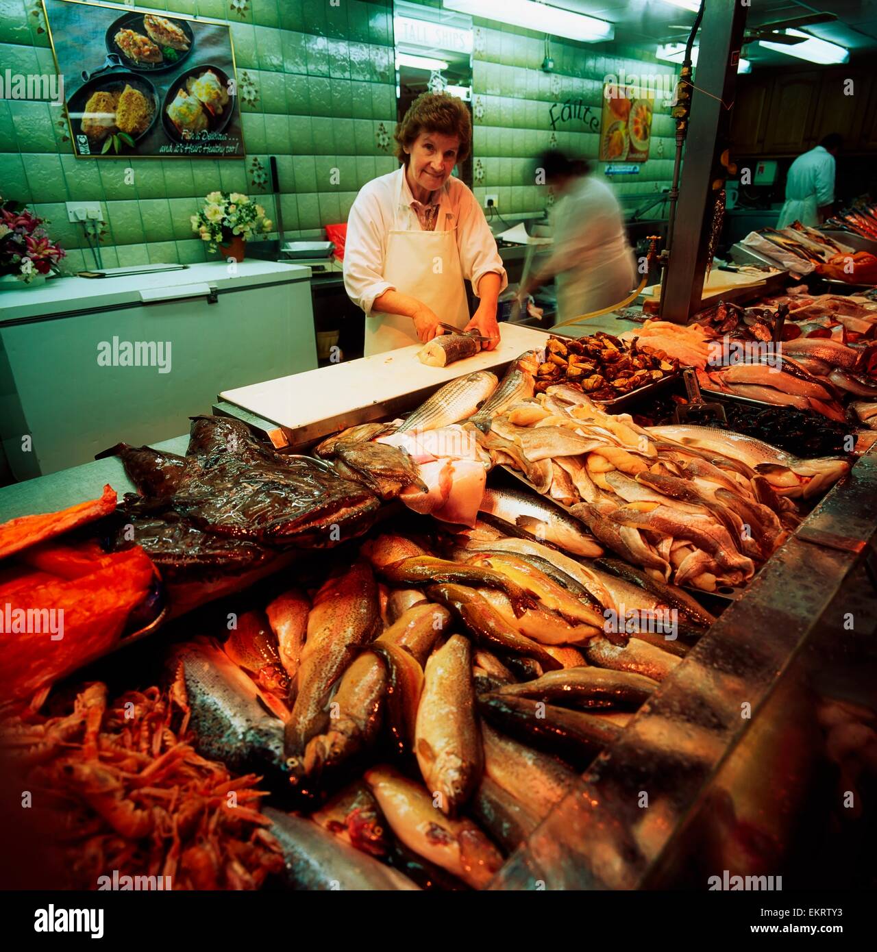 Cork,Co Cork,Ireland;Woman Preparing Fish At The English Market Stock Photo