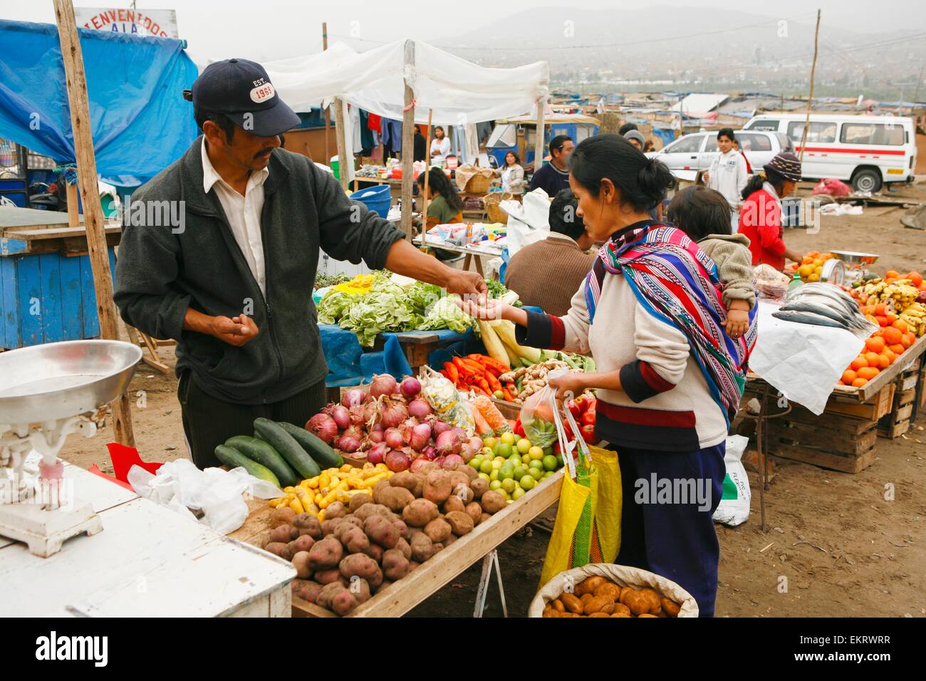 Purchasing Fresh Vegetables From Market Stall, Lima, Peru Stock Photo