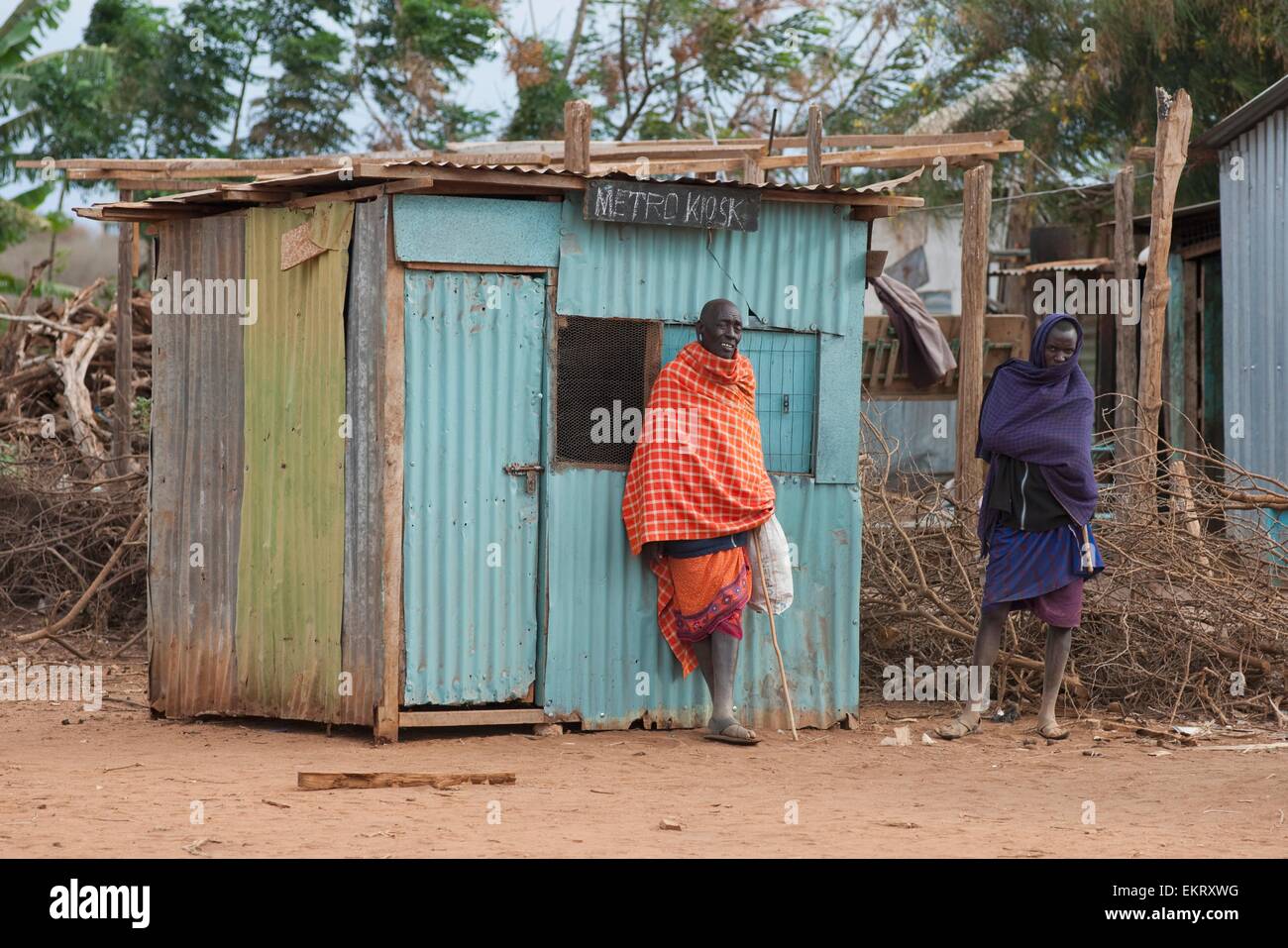 Two Maasai Men Outside Of Tin Hut, Kenya, Africa Stock Photo Alamy