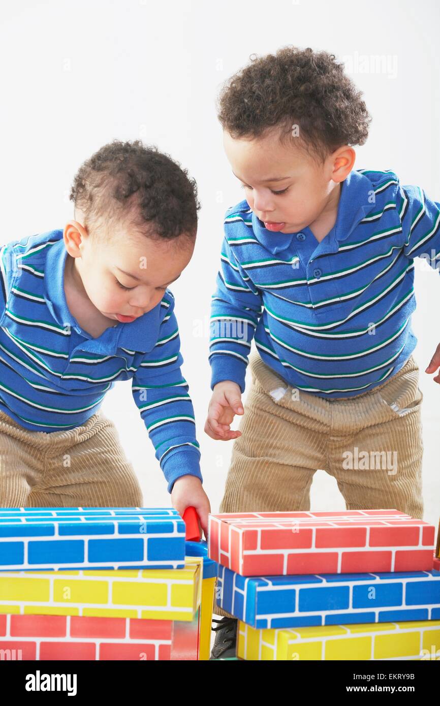 Knoxville, Tennessee, United States Of America; Twin Boys Building With Blocks Stock Photo