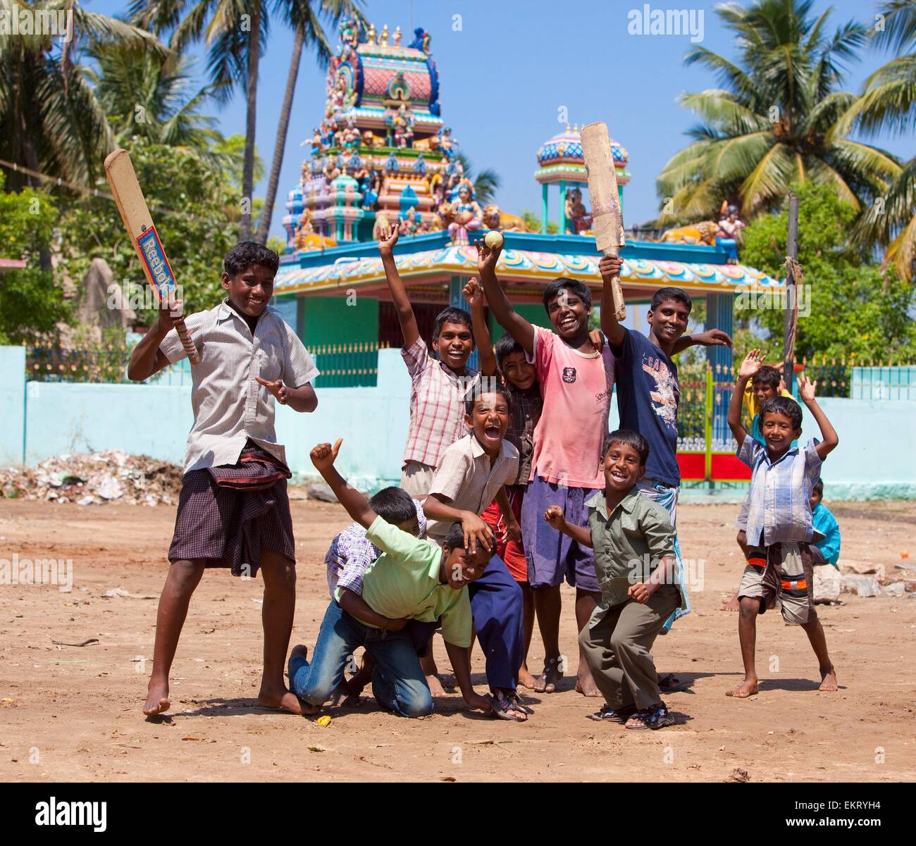 A Group Of Boys Holding Cricket Bats And Cheering; Sathyamangalam, Tamil Nadu, India Stock Photo