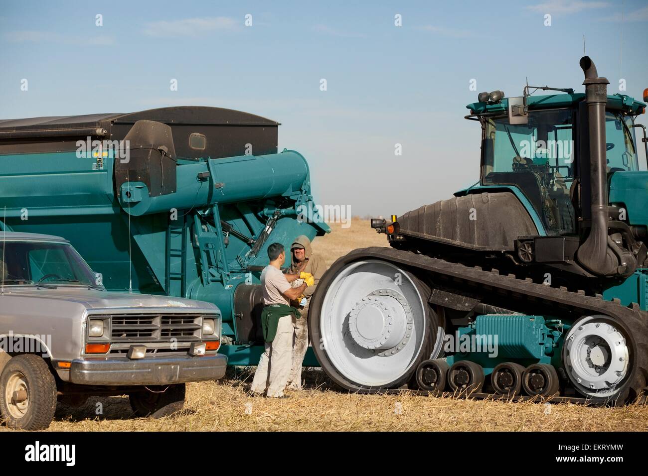 Two Farmers With Farm Machinery; Three Hills, Alberta, Canada Stock Photo Alamy