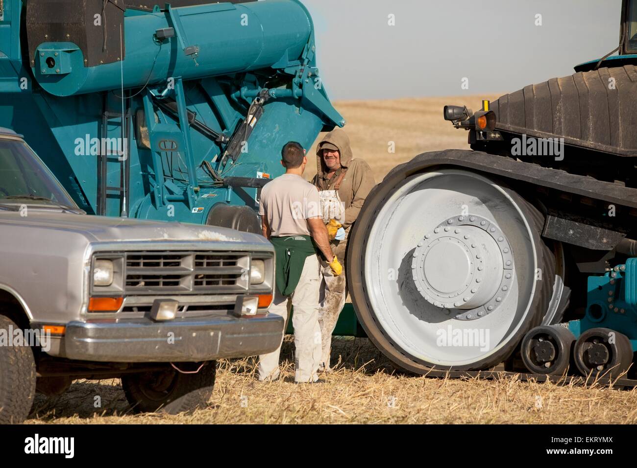 Two Farmers With Farm Machinery; Three Hills, Alberta, Canada Stock Photo Alamy