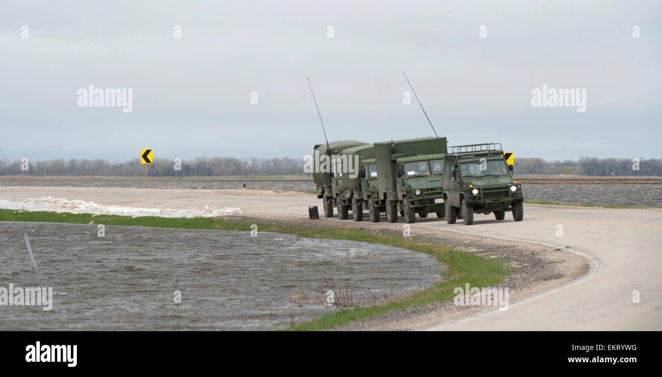Army Trucks Arrive To Provide Aid To A Flooded Area; St. Francois Xavier Manitoba Canada Stock Photo
