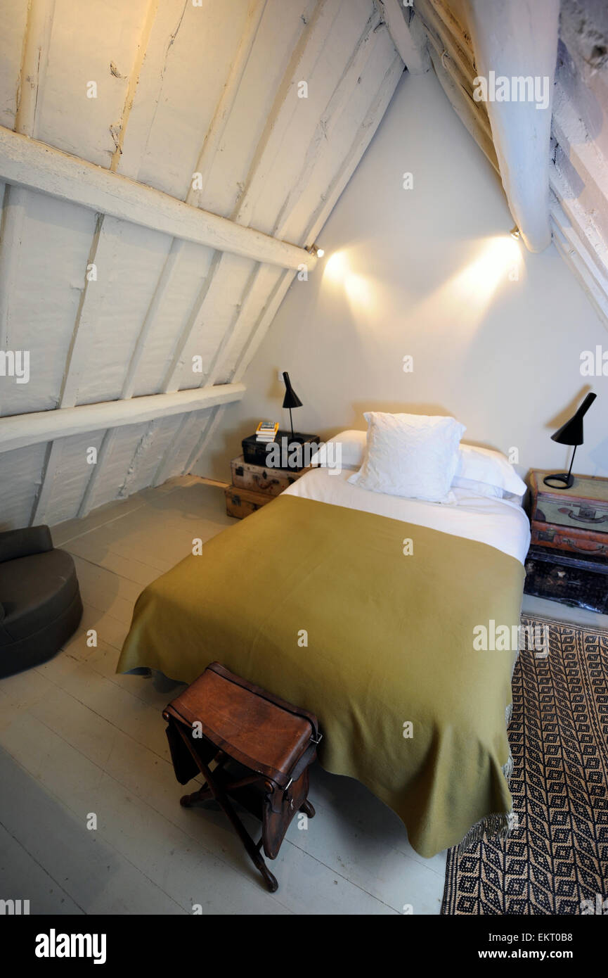 A spare bedroom in the attic space of a country cottage UK Stock Photo