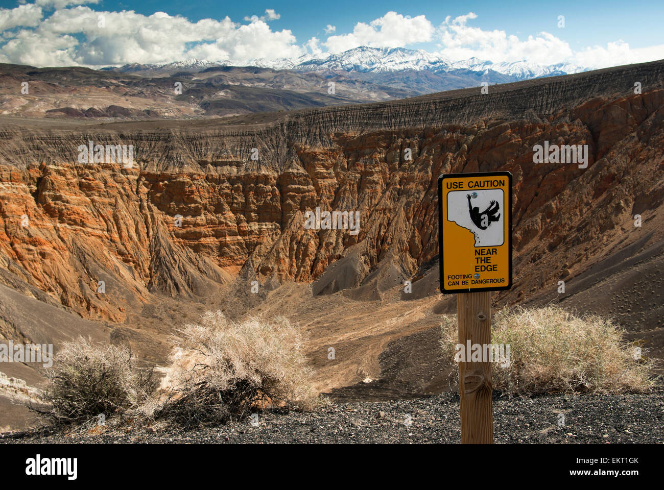 Caution Sign At Edge Of Ubehebe Crater Hiking Trail In Death Valley National Park; California Usa Stock Photo