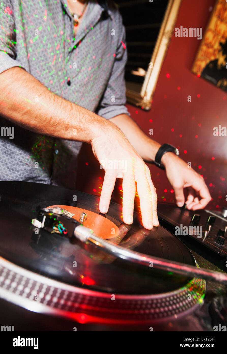 Disc Jockey Plays Recorded Music From A Vinyl Record; Gold Coast