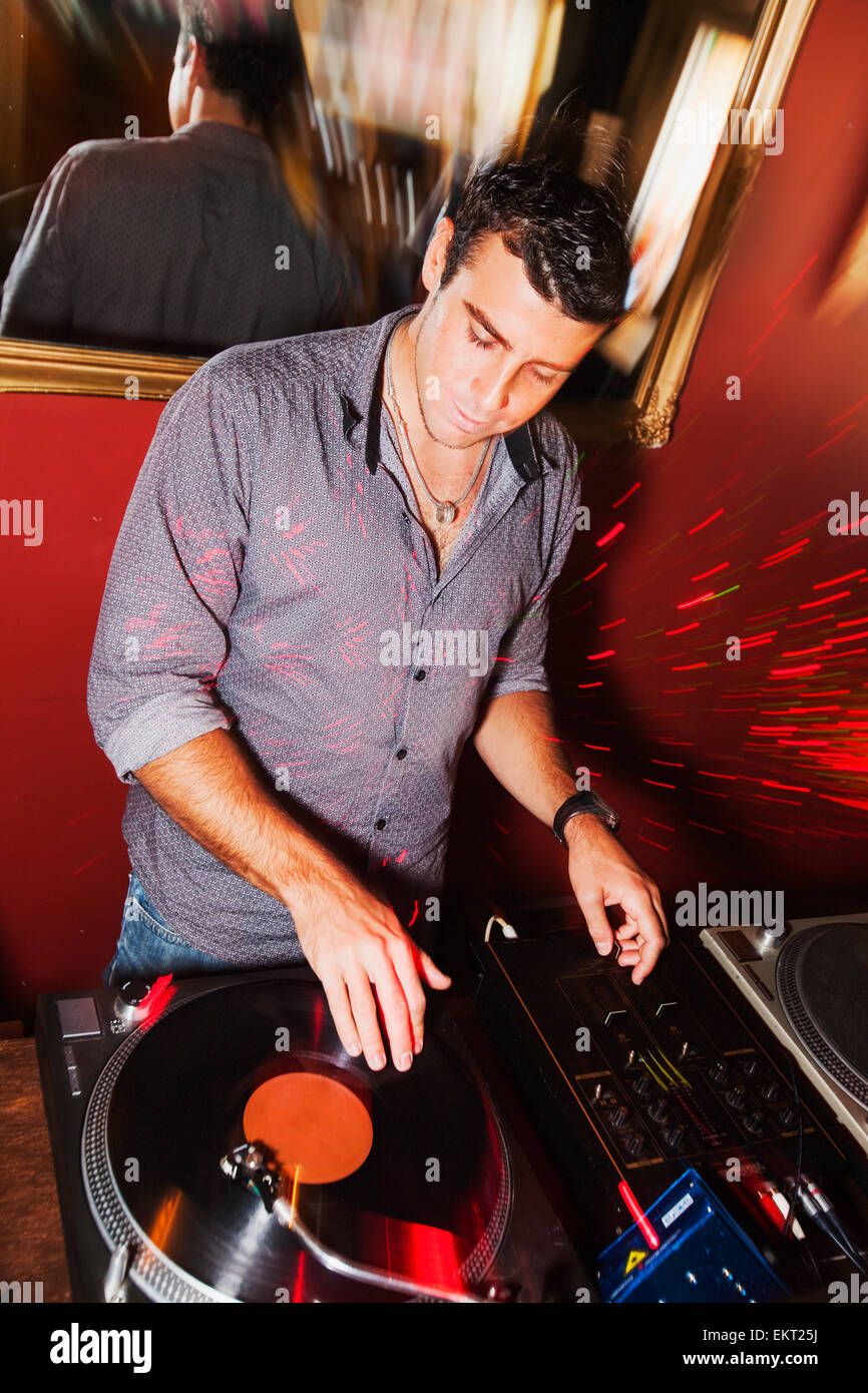 Disc Jockey Plays Recorded Music From A Vinyl Record; Gold Coast