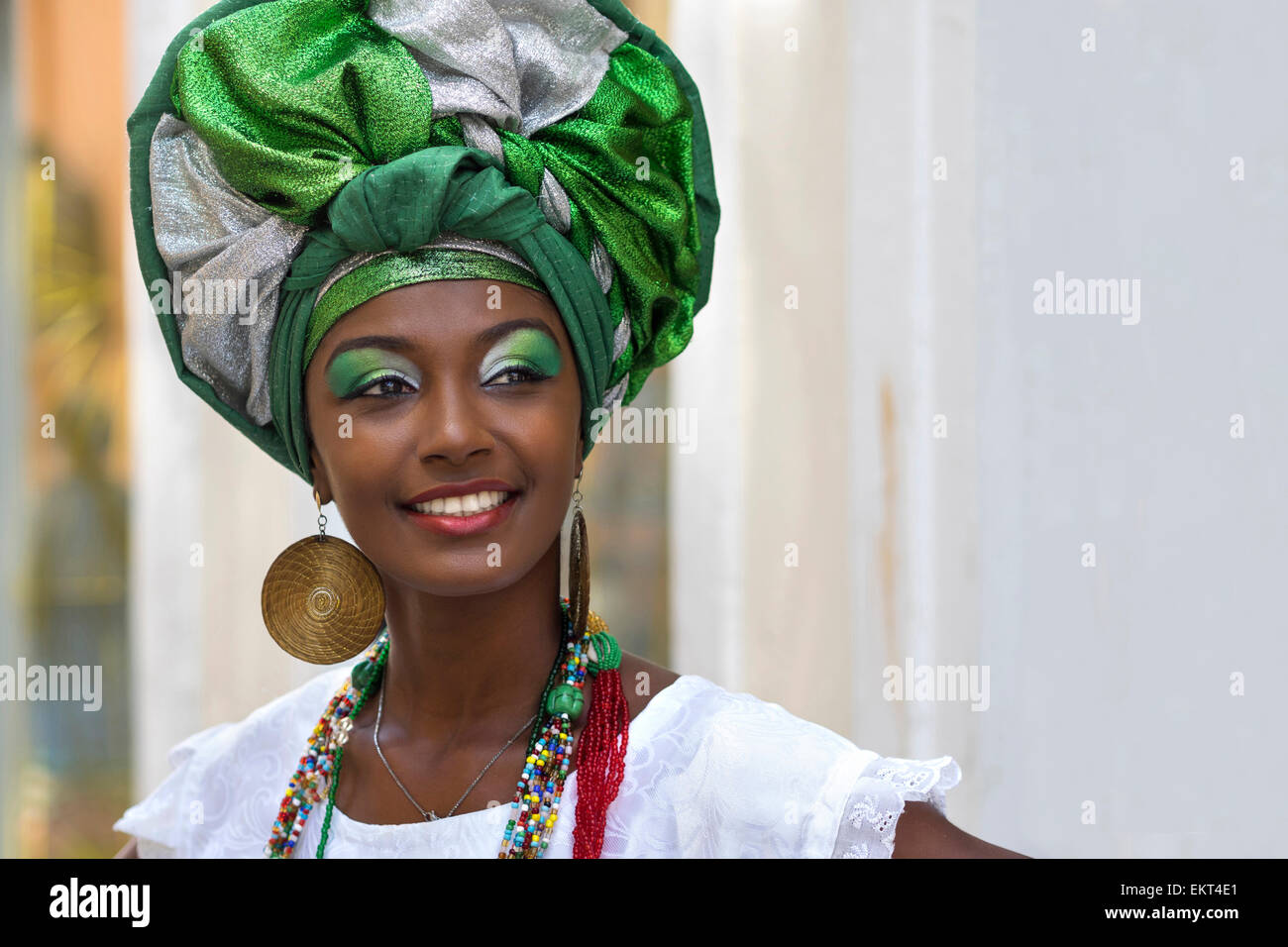 Baiana, Brazilian woman of African descent, smiling, wearing traditional attire in Pelourinho, Salvador, Bahia, Brazil. Stock Photo