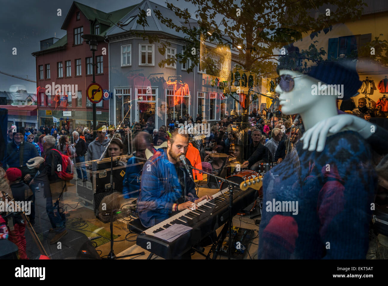 Band playing in a store- crowd look on, annual end of summer festival-Cultural Festival (Menningarnott), Reykjavik, Iceland Stock Photo