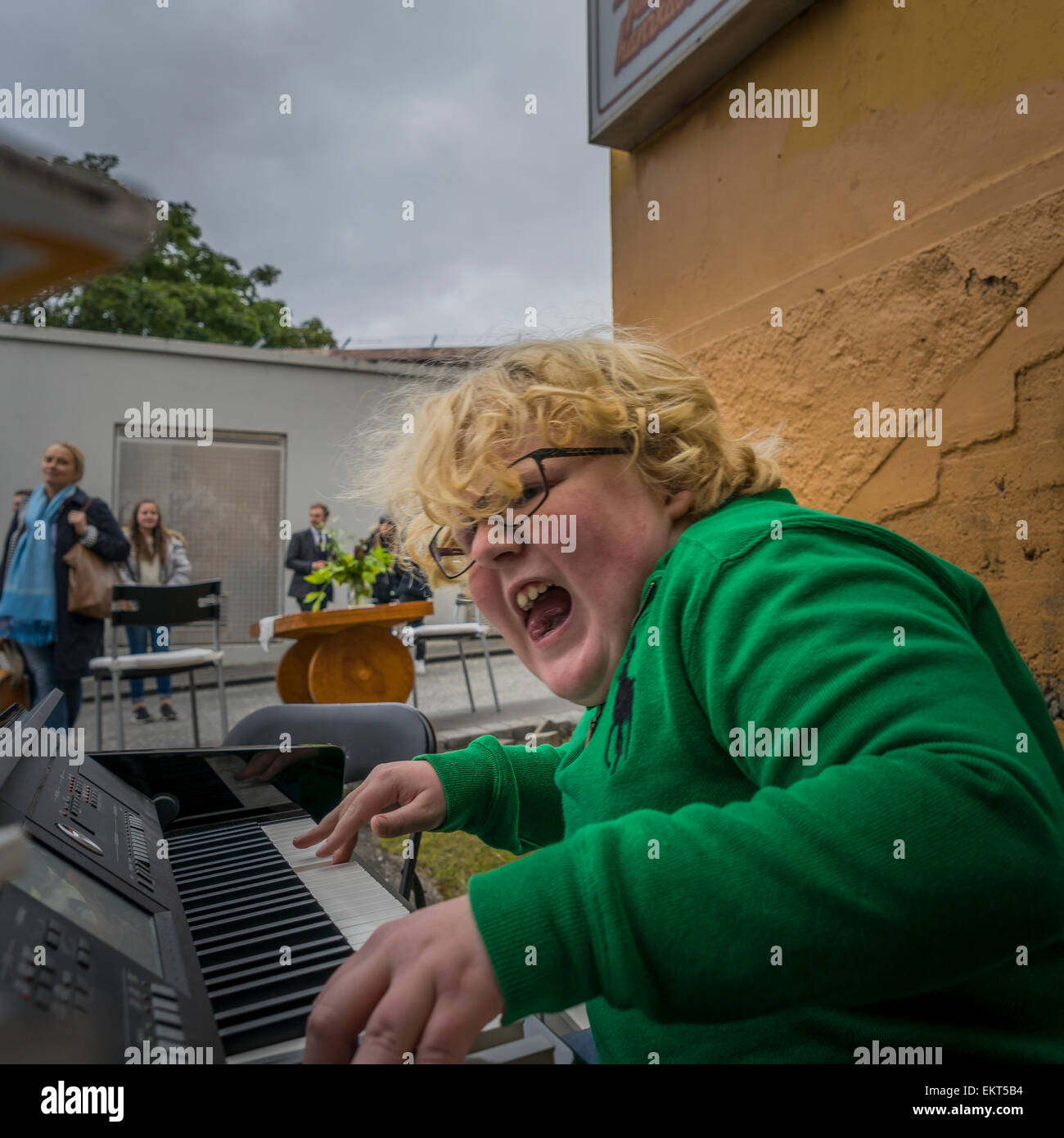 Boy playing piano and singing. Annual end of summer festival-Cultural Festival (Menningarnott),  Reykjavik, Iceland Stock Photo