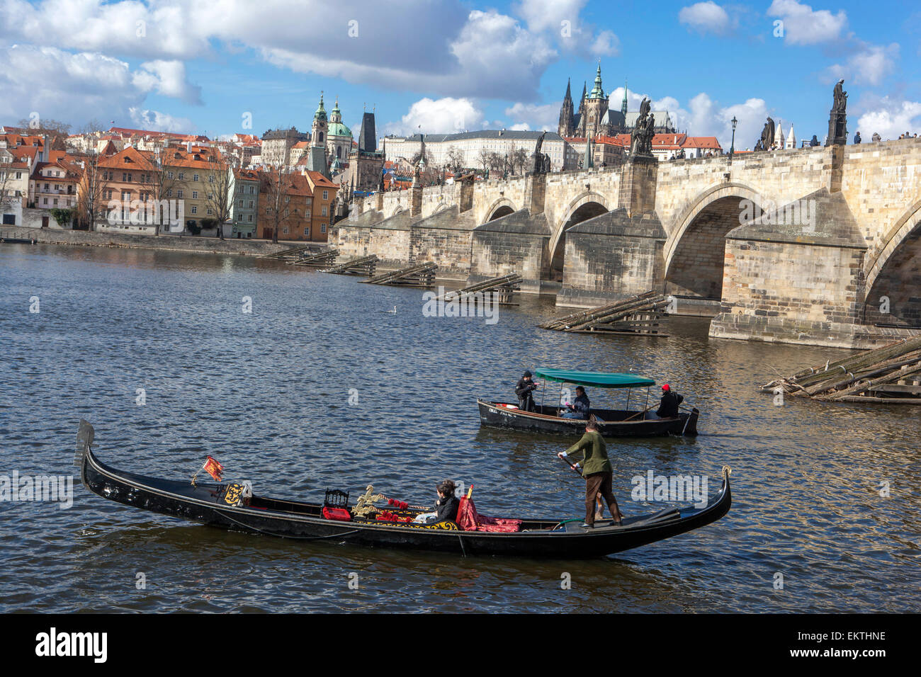 Venetian gondola on the river Vltava under Charles Bridge, Prague, Czech Republic Stock Photo
