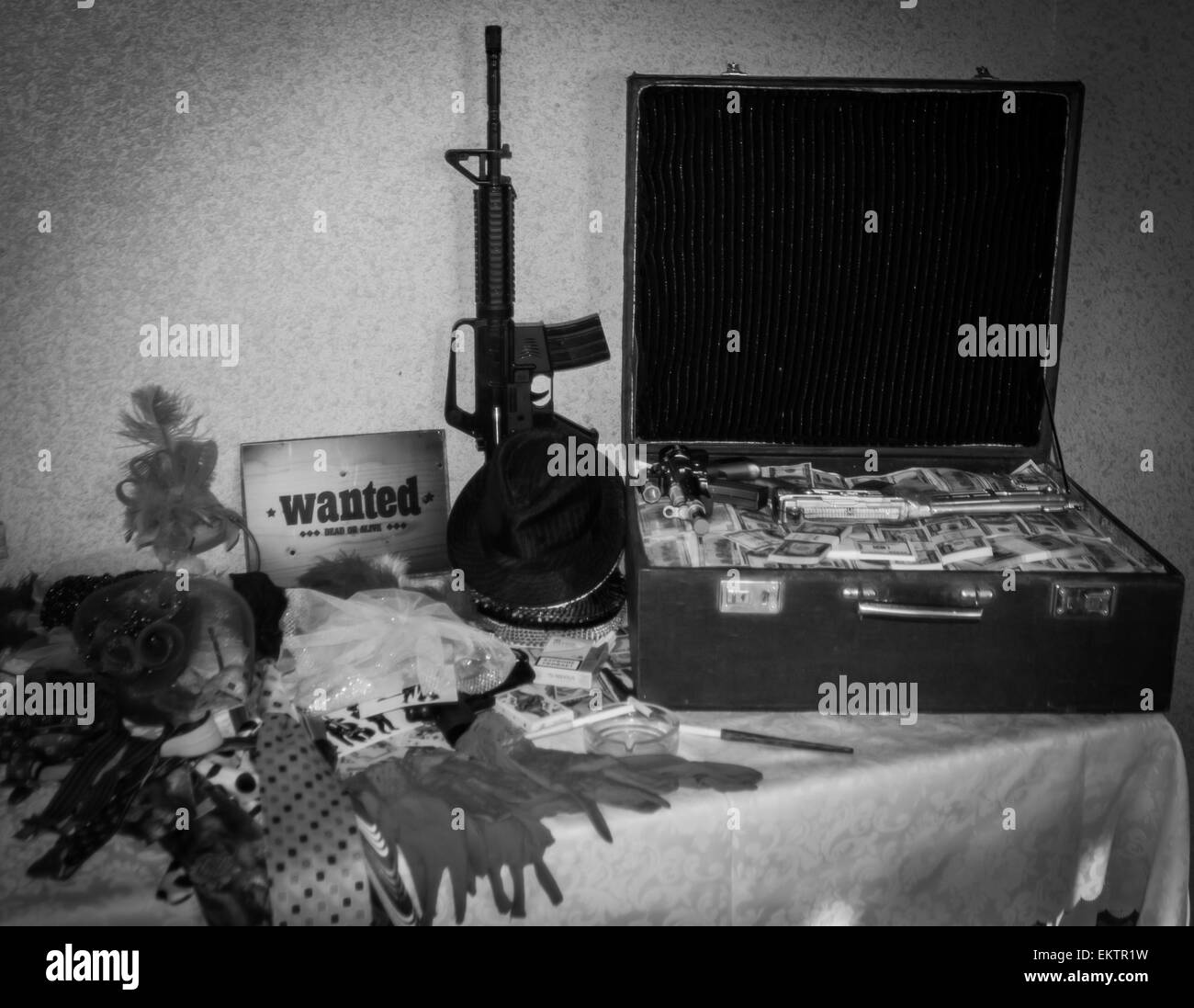 Large suitcase of money, weapons, and the plate is wanted Stock Photo