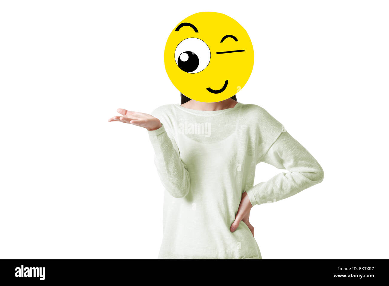 Young woman with a winking emoticon face in front of her face Stock ...