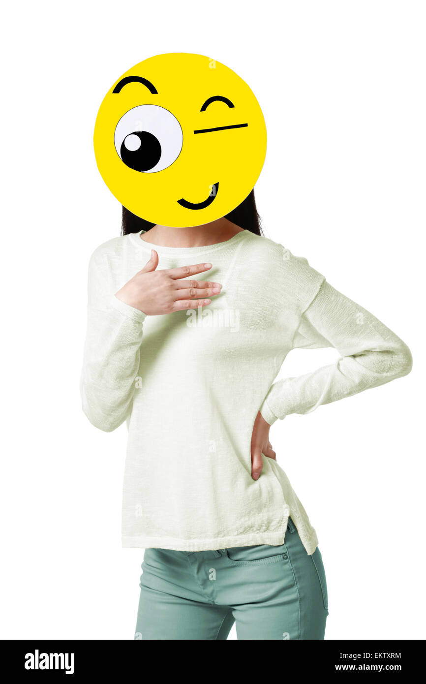 Young woman with a winking emoticon face in front of her face Stock Photo
