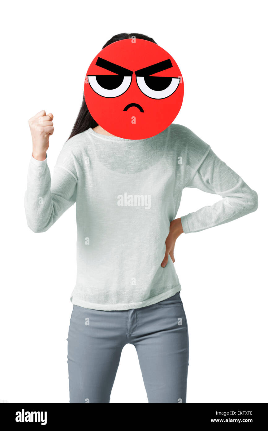 Young woman with a angry emoticon face in front of her face Stock Photo