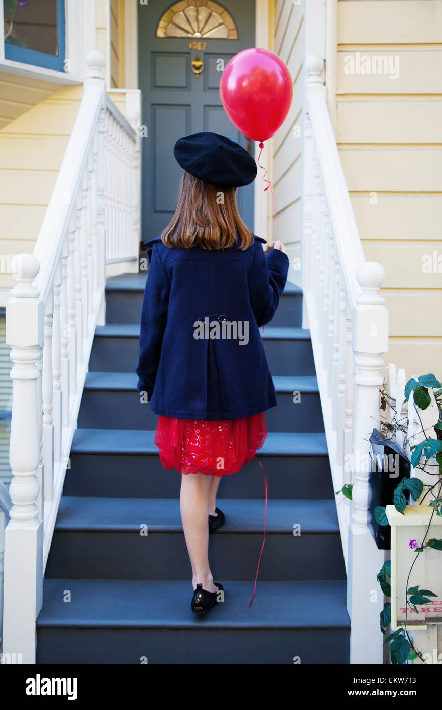 Brunette girl walking up stairs hi-res stock photography and images - Alamy