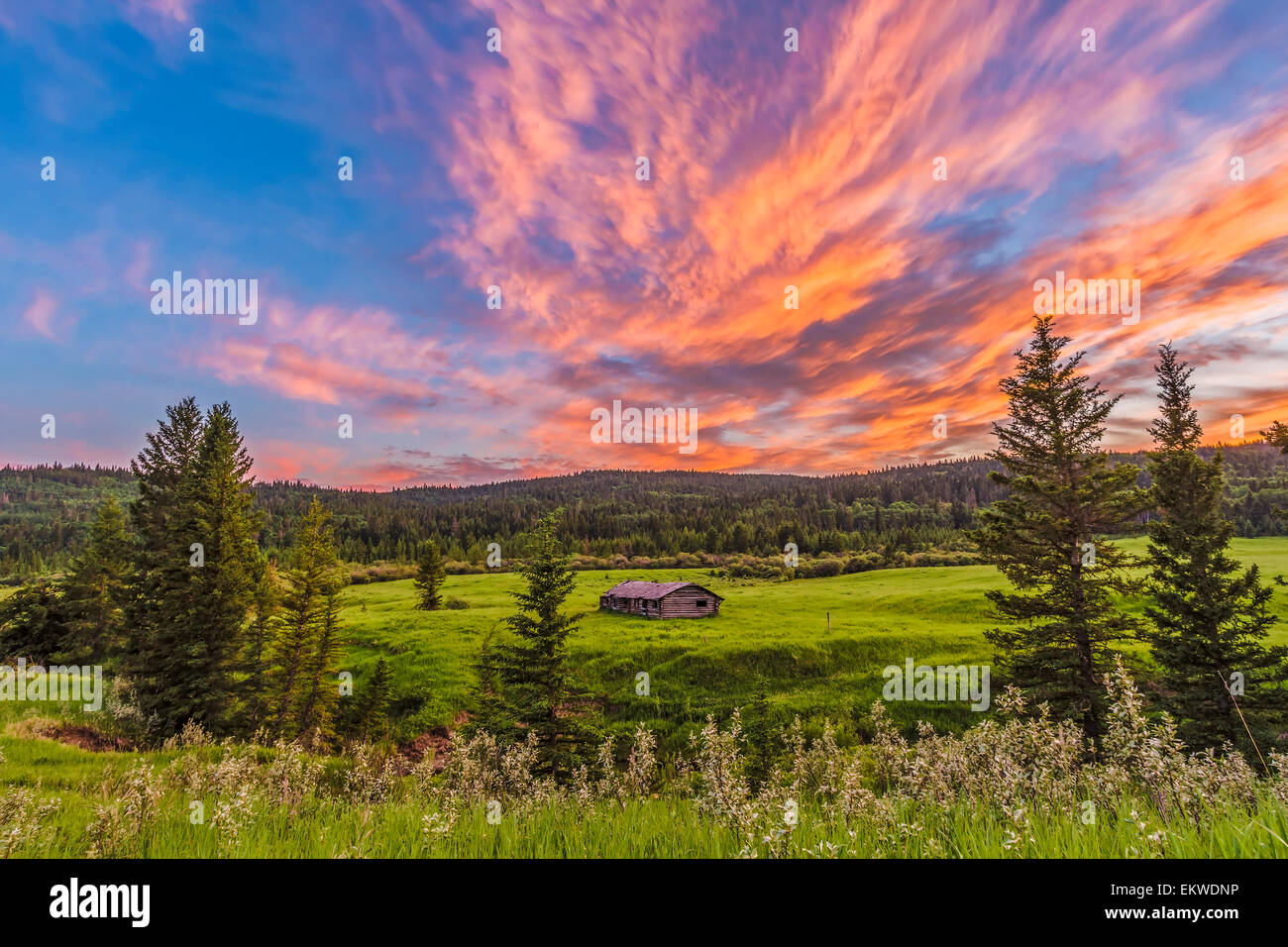 July 9, 2014 - A high dynamic range photo of a sunset over a log cabin at Cypress Hills Interprovincial Park, on the Saskatchewa Stock Photo