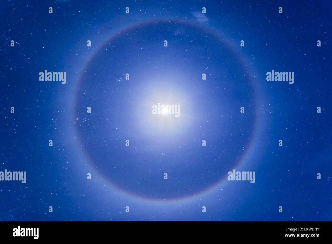 January 27, 2015 - An ice crystal halo around the first quarter moon high in the northern winter sky near Pinos Altos, New Mexic Stock Photo