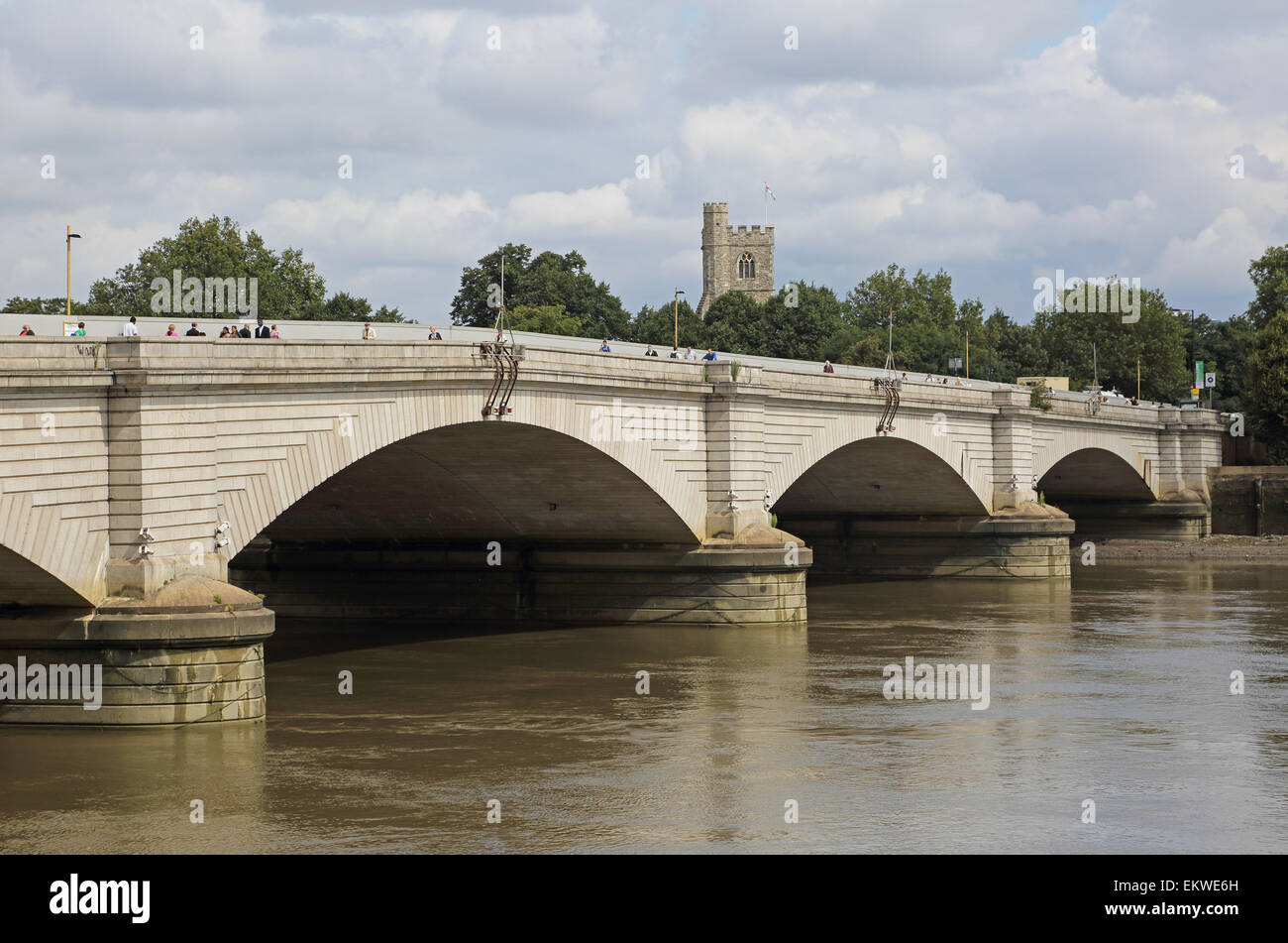 Putney Bridge, west London. Viewed from the south east.  Showing the River Thames and the tower of All Saints church, Fulham Stock Photo