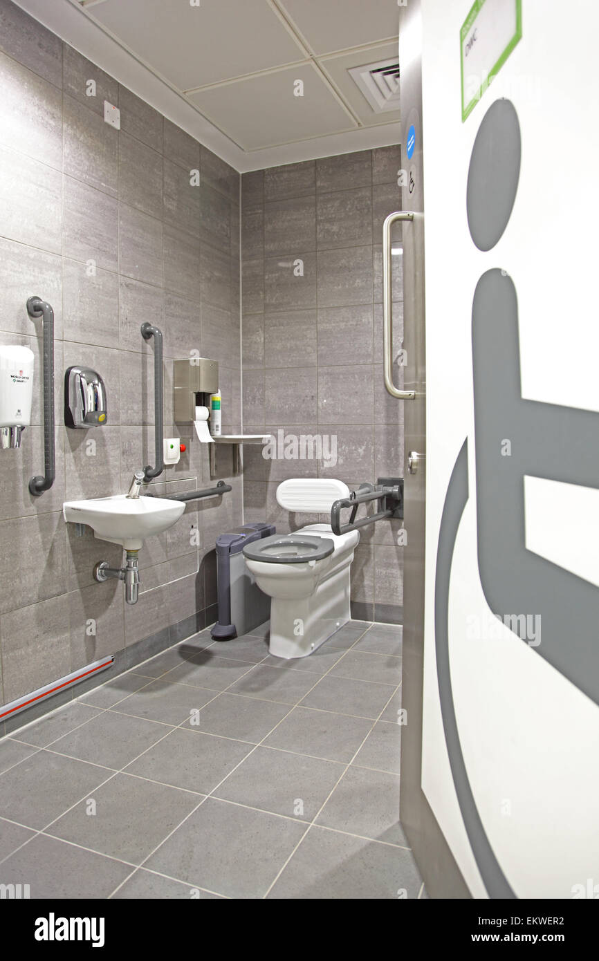 A top-specification disabled toilet showing a giant disabled symbol graphic  on the entry door Stock Photo
