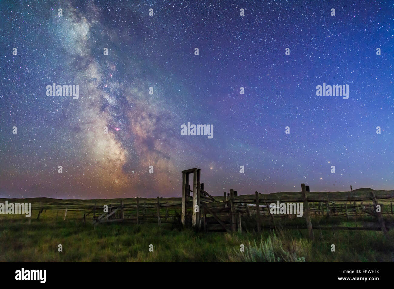 August 27-28, 2014 - Mars (bottom) and Saturn in conjunction at right, and the Milky Way at left, in deep blue twilight over the Stock Photo