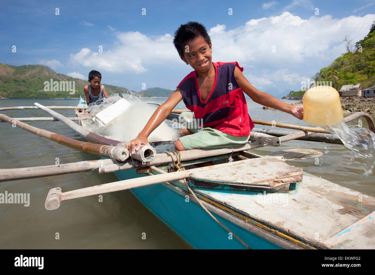 Child,Boat,Wooden,Labor,Fishing,Bailing,Bangka Stock Photo