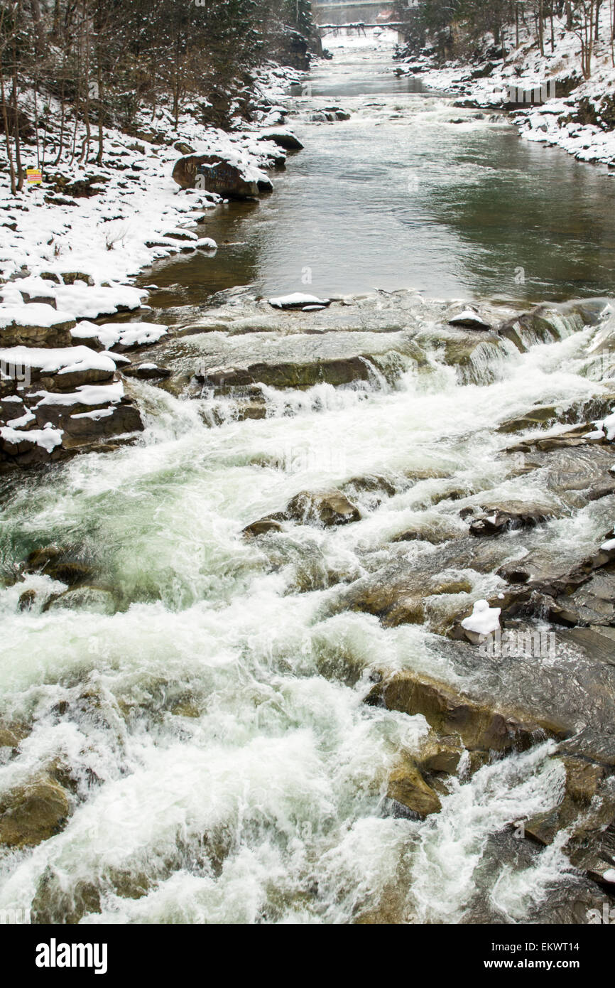 Winter mountain landscape with river and forest, Prut river in Carpathians, Ukraine Stock Photo