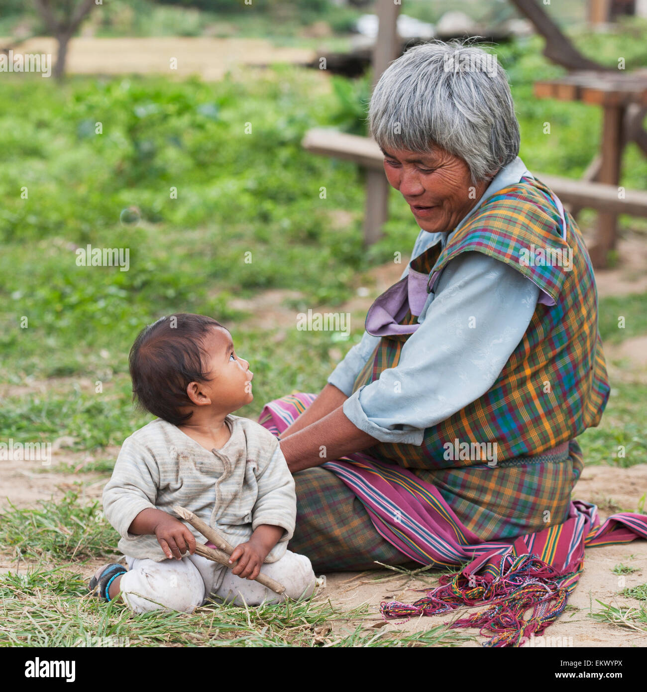 Senior Bhutanese Woman With Baby; Punakha District Bhutan Stock Photo