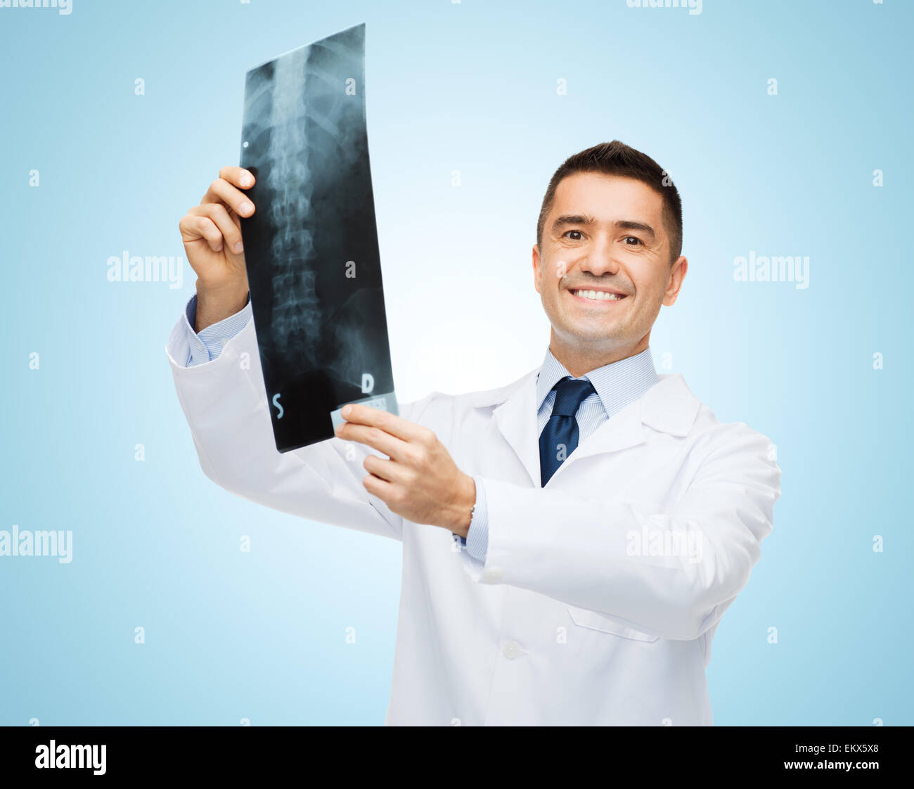 smiling male doctor in white coat holding x-ray Stock Photo - Alamy