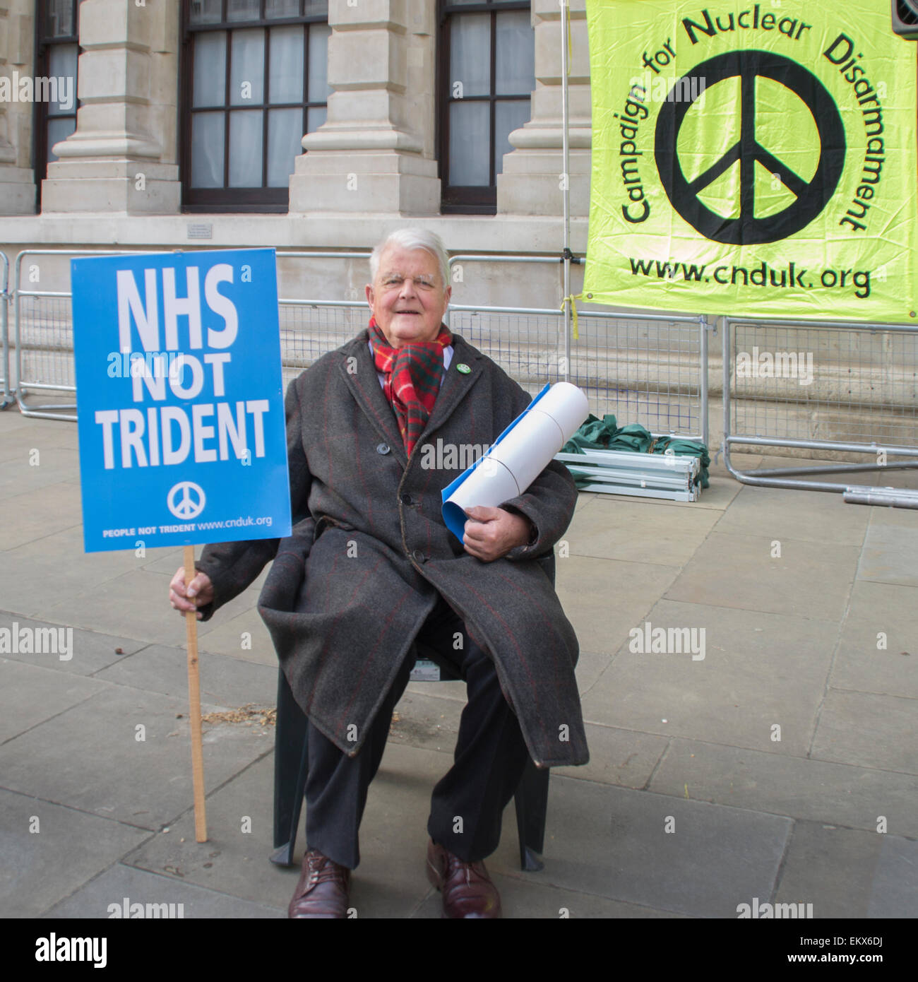 Whitehall, London, UK. 13th April, 2015. Bruce Kent a well known activist and honorary vice president of CND at Vote Out Trident, an evening of Party and Protest against the renewal of Trident outside the Ministry of Defence building. Credit:  Paul Mendoza/Alamy Live News Stock Photo