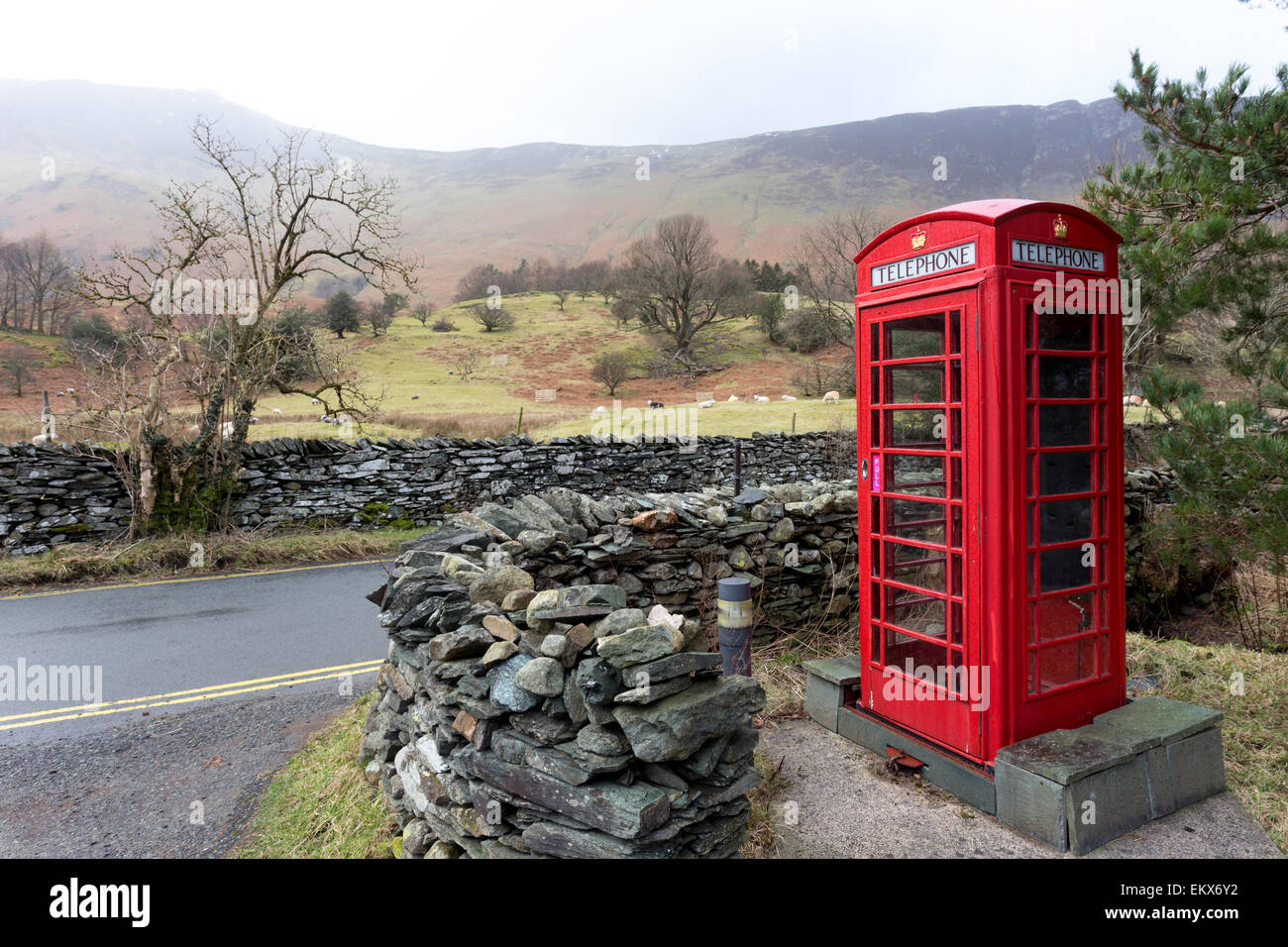 An iconic English telephone box in the Lake District National Park. The phone boxes were once important for communication but fe Stock Photo