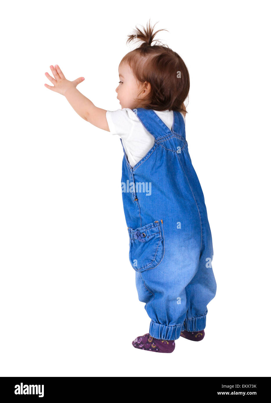 Child stands and look out, isolated on white. Back view Stock Photo