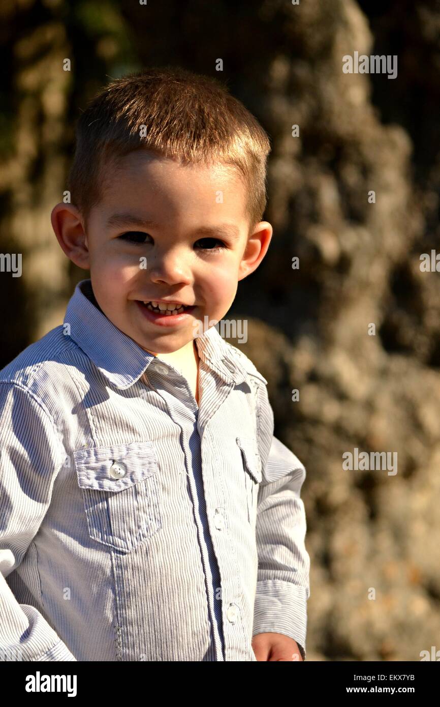A handsome, cute smiling 3 year old boy . Stock Photo