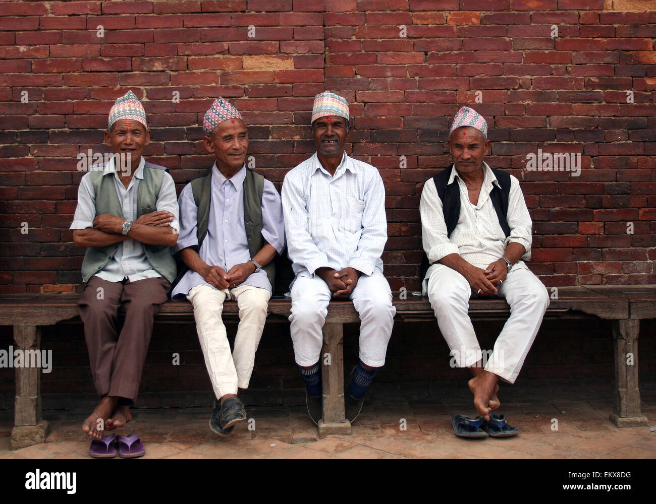 Local Nepalese Men wearing the Dhaka Topi traditional hat.  Durbar Square, Kathmandu, Nepal Stock Photo