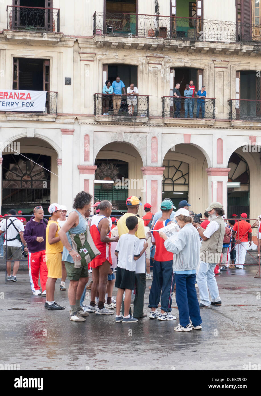 Groups of people after the Havana marathon outside curves arches and layered balconies of the  classical Spanish architecture Stock Photo