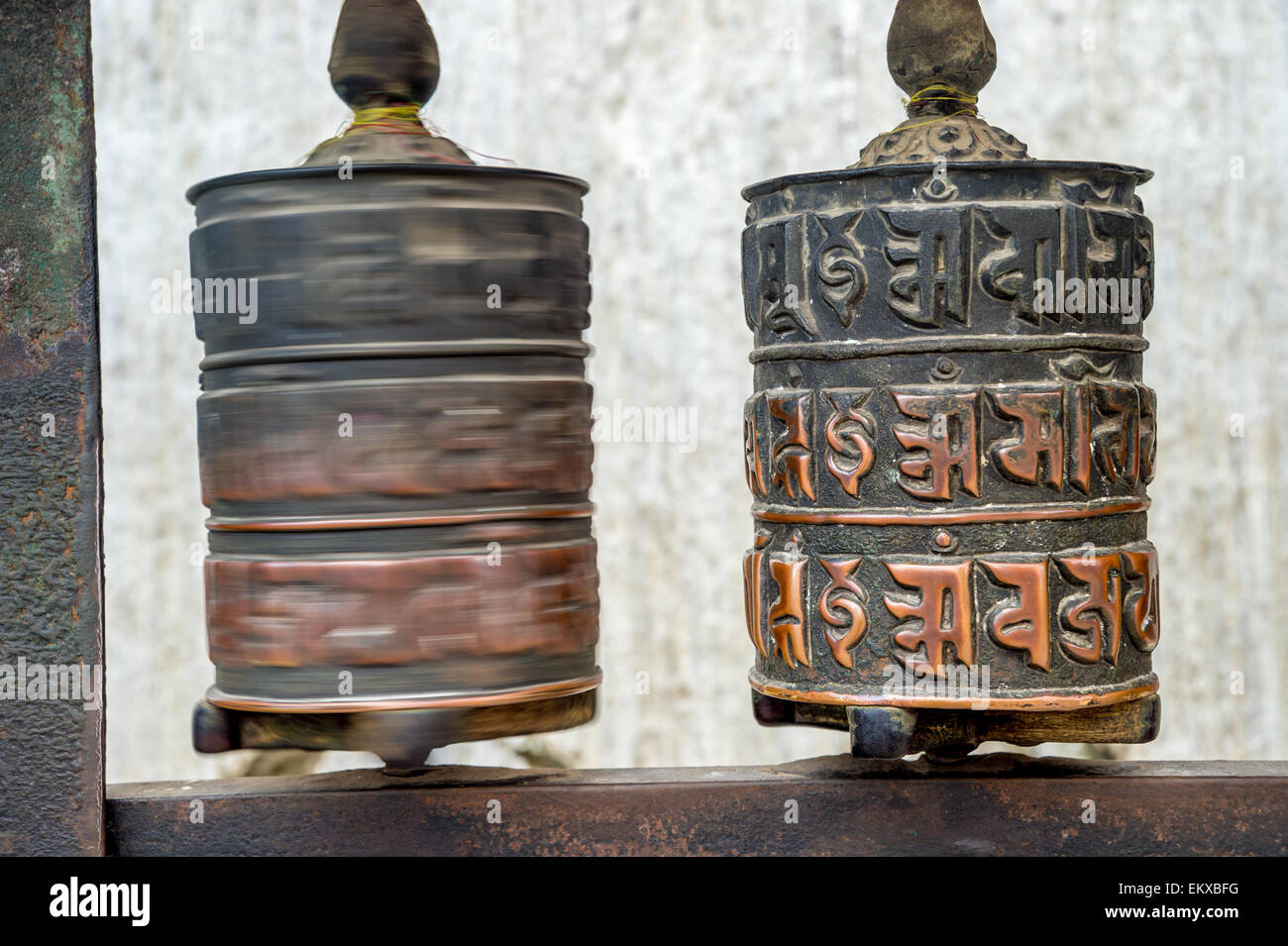 Two prayer wheels at Swayambhunath Monkey temple in Kathmandu, Nepal ...