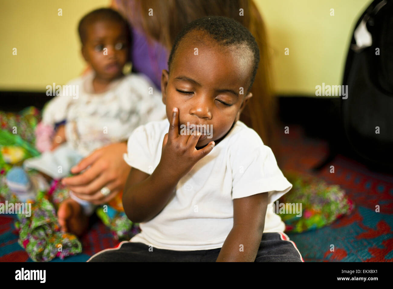 Ugandan Child With His Fingers In His Mouth At Sanyu Babies Home