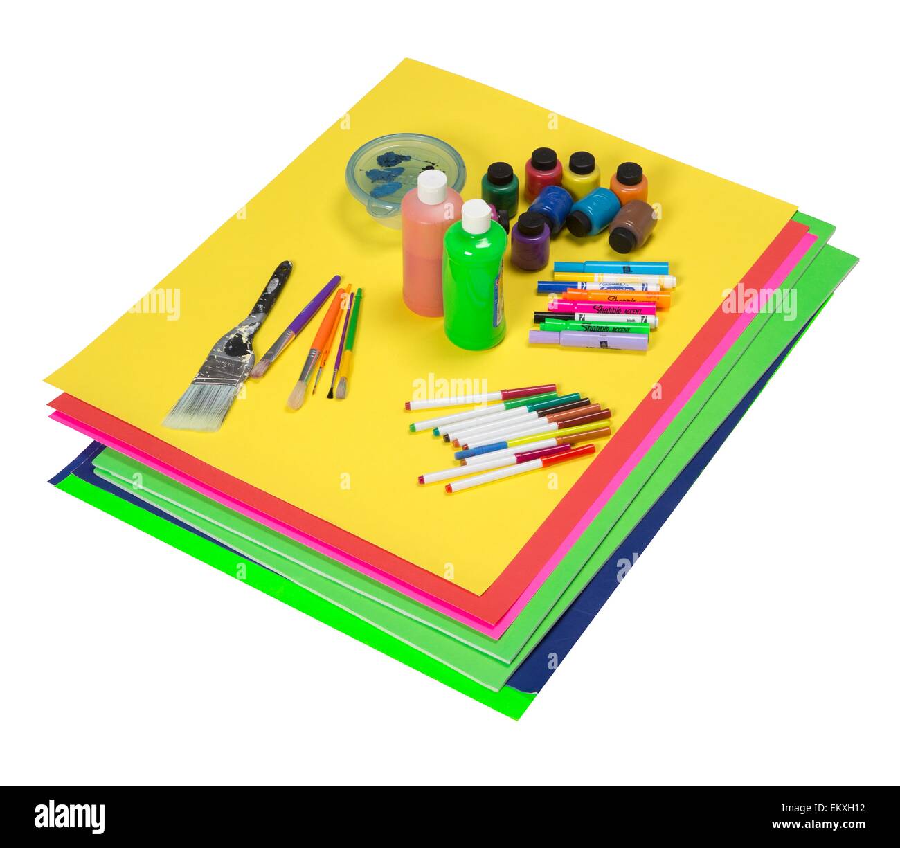 Art supplies which include colorful poster boards, paint, markers, and brushes Stock Photo