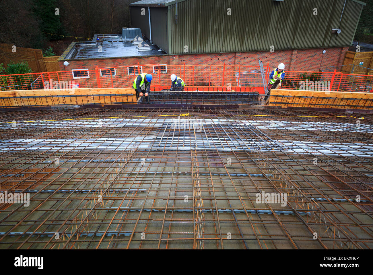 Concrete reinforcing bars laid on roof prior to pouring. Stock Photo