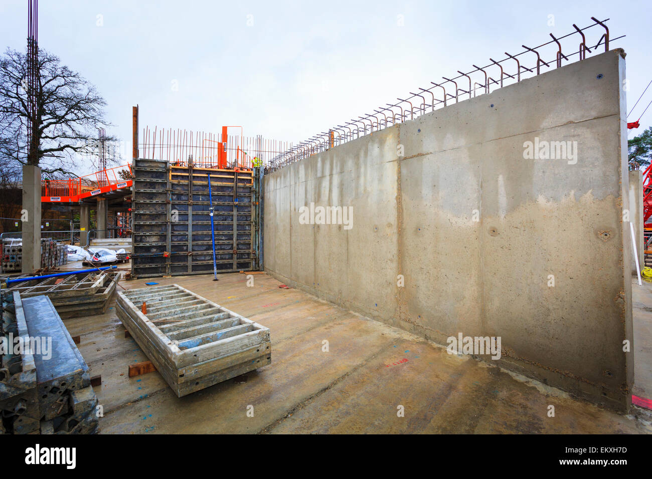 Poured concrete reinforced walls on building site. Stock Photo