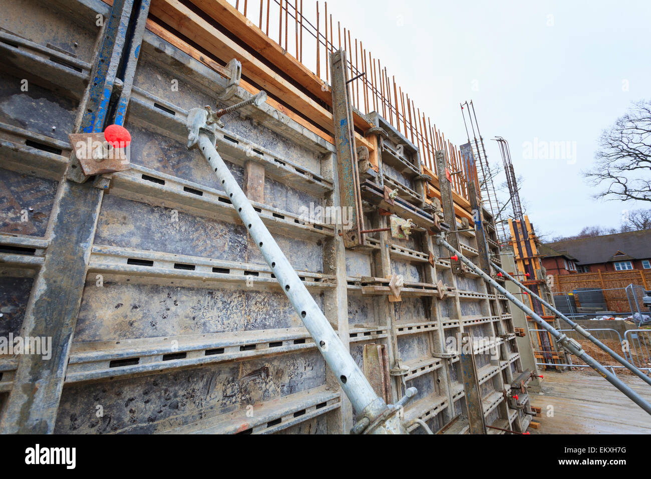 Supported formework around poured concrete walls on building site Stock Photo