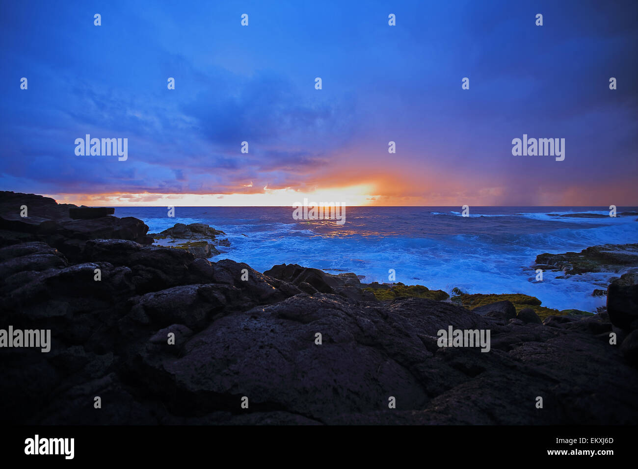 Sunrise along the lava rocky coastline of the big island of Hawaii Stock Photo