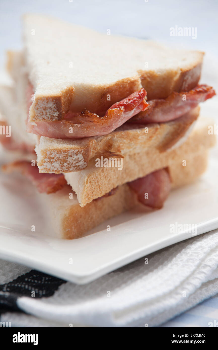 Bacon sandwich on a white plate Stock Photo