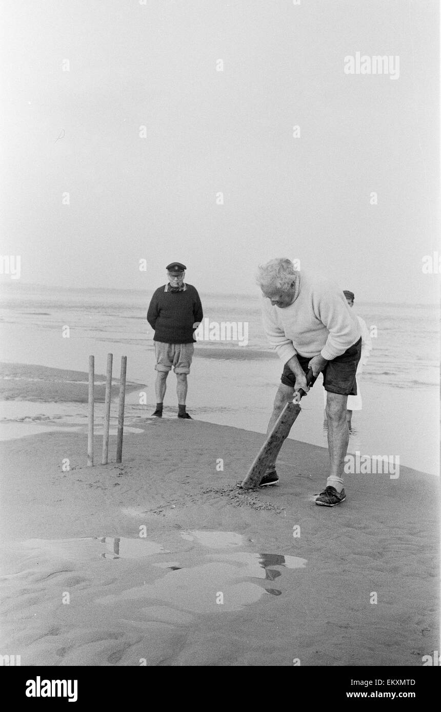 Brambles sandbank cricket match. 'Action' shots from the annual cricket match between the Royal Southern Yacht Club and the Island Sailing Club on a sandbank on the Isle of Wight. 18th September 1966 Stock Photo
