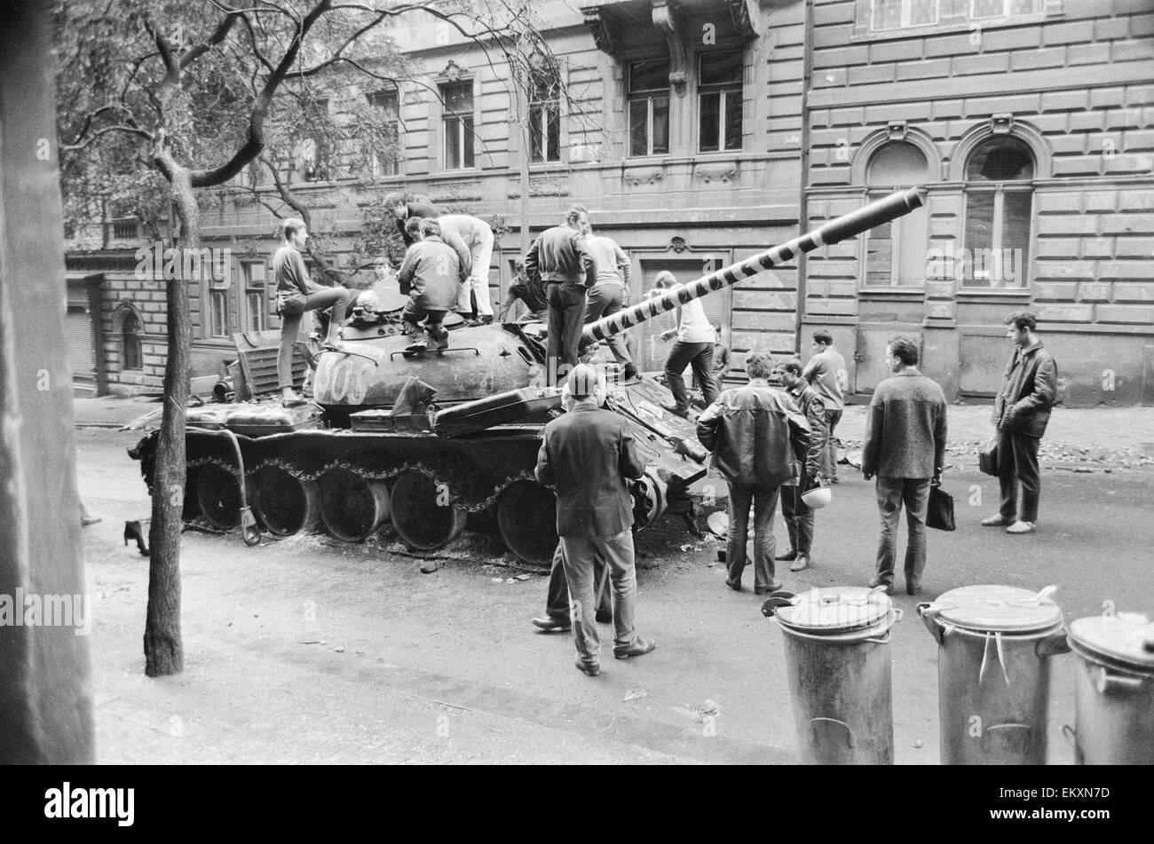 Prague, Czechoslovakia. End of the Prague Spring, a period of political liberalization in Czechoslovakia during the era of its domination by the Soviet Union after World War II. Czech children playing on a burnt out Russian tank. August 1968. Stock Photo