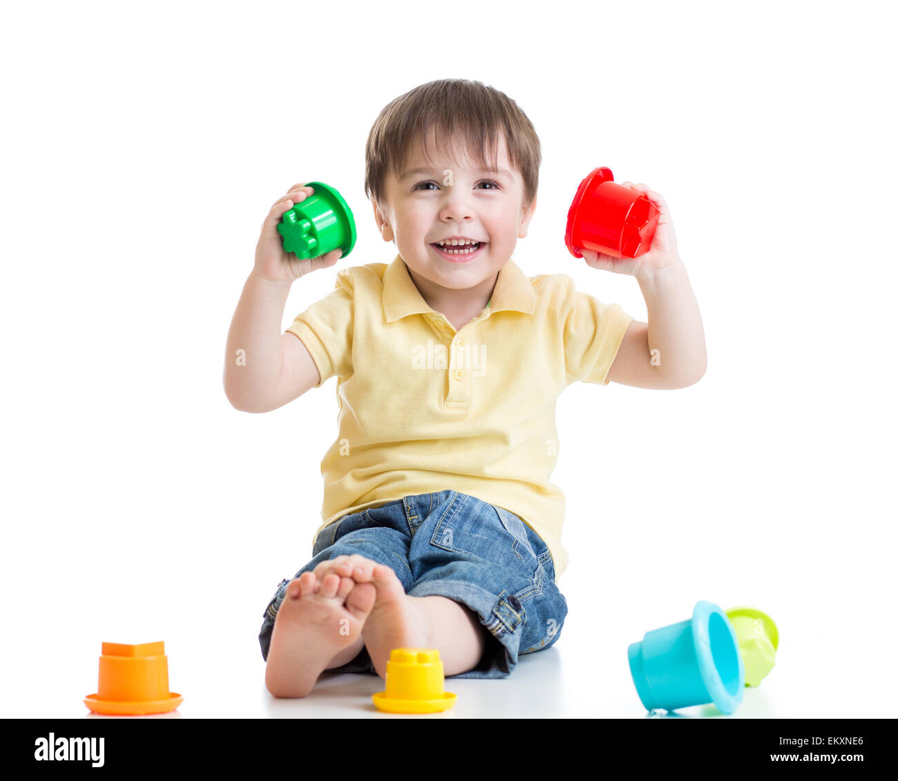 smiling child boy playing with color toys Stock Photo - Alamy