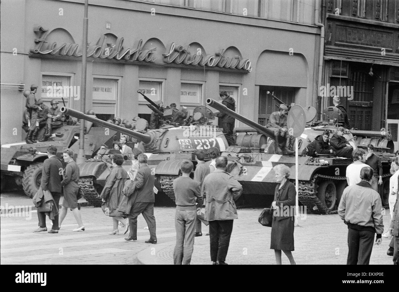 Prague, Czechoslovakia. End of the Prague Spring, a period of political liberalization in Czechoslovakia during the era of its domination by the Soviet Union after World War II. A Russian tank patrols in Wenselas Square as locals walk by. August 1968. Stock Photo